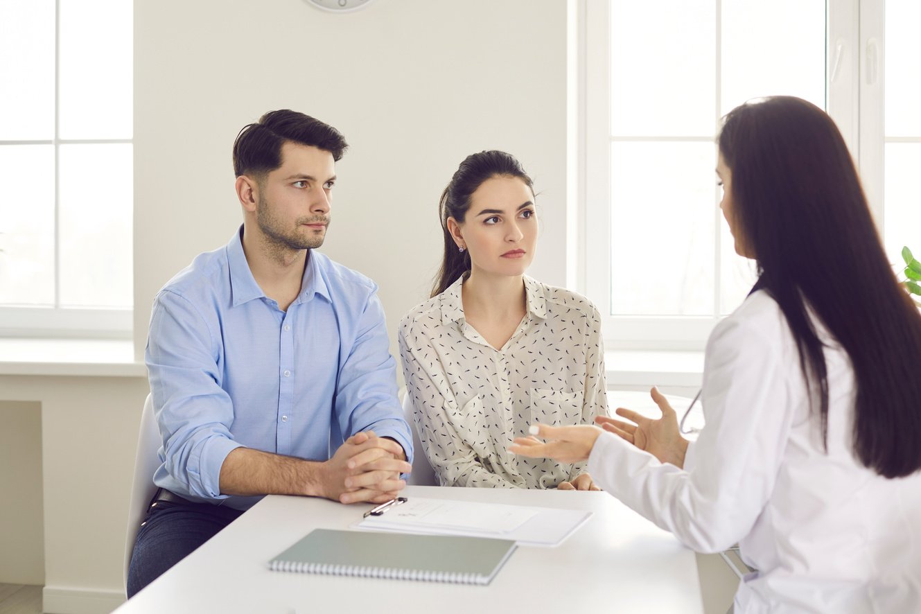 Doctor Consultation with Couple about Medical Treatment